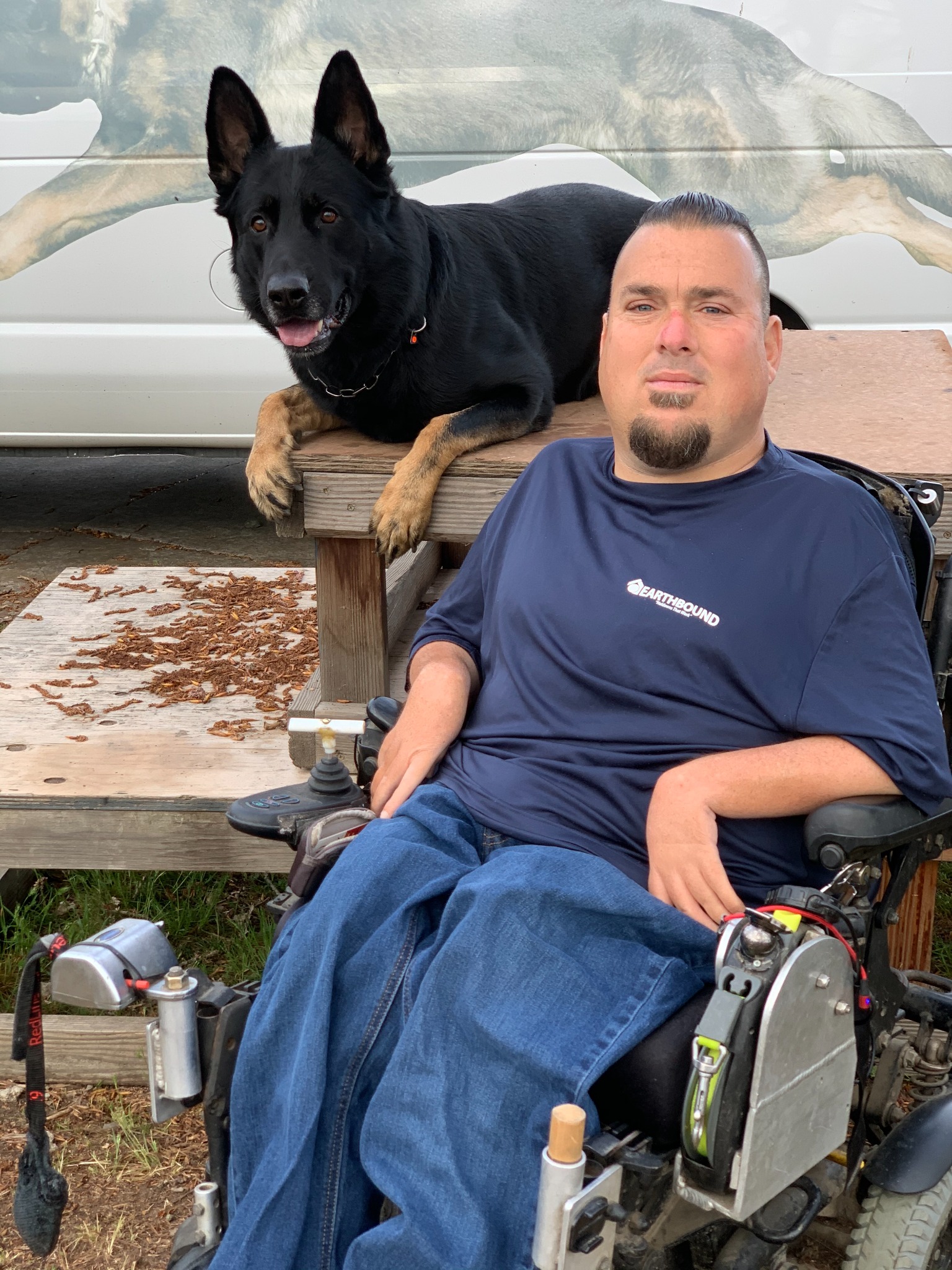 Jason Lake with black German Shepherd